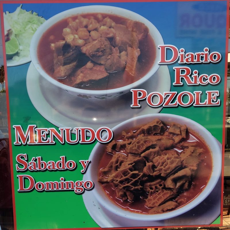 Window poster for pozole every day and menudo on Saturday and Sunday