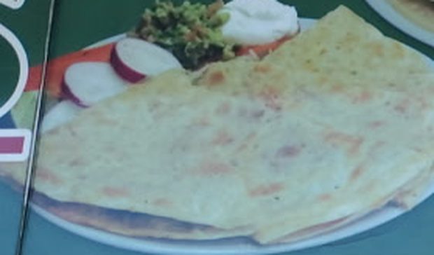 Large flour tortilla quesadilla with meat and cheese